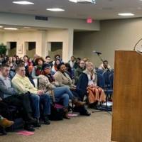 Photo from behind Patricia that shows her and the crowd